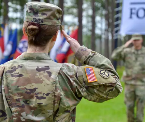 Service member salutes