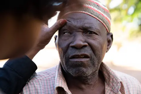 A man has his eyes examined for trachoma in Mozambique.